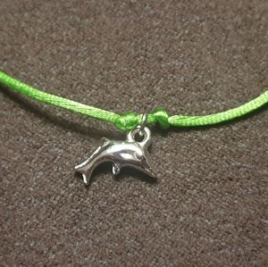 Dolphin for good luck adjustable green string
